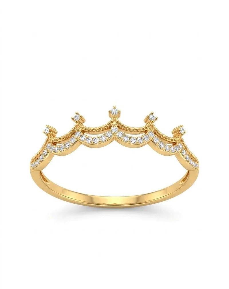 A gold crown-shaped ring with small clear pavé stones along the scalloped top, shown on a plain white background.