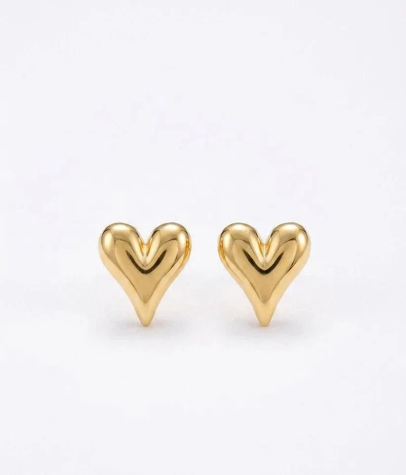 A pair of polished gold heart-shaped stud earrings on a clean white background.
