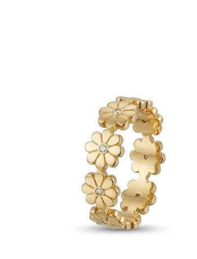 Gold floral ring with embedded diamonds on a white background