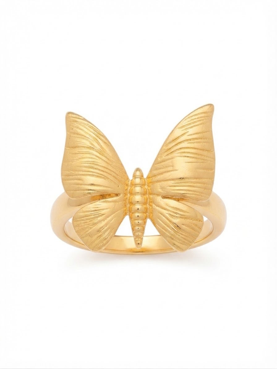 A gold butterfly ring with textured wings and a polished band, shown on a plain white background.