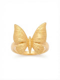 A gold butterfly ring with textured wings and a polished band, shown on a plain white background.