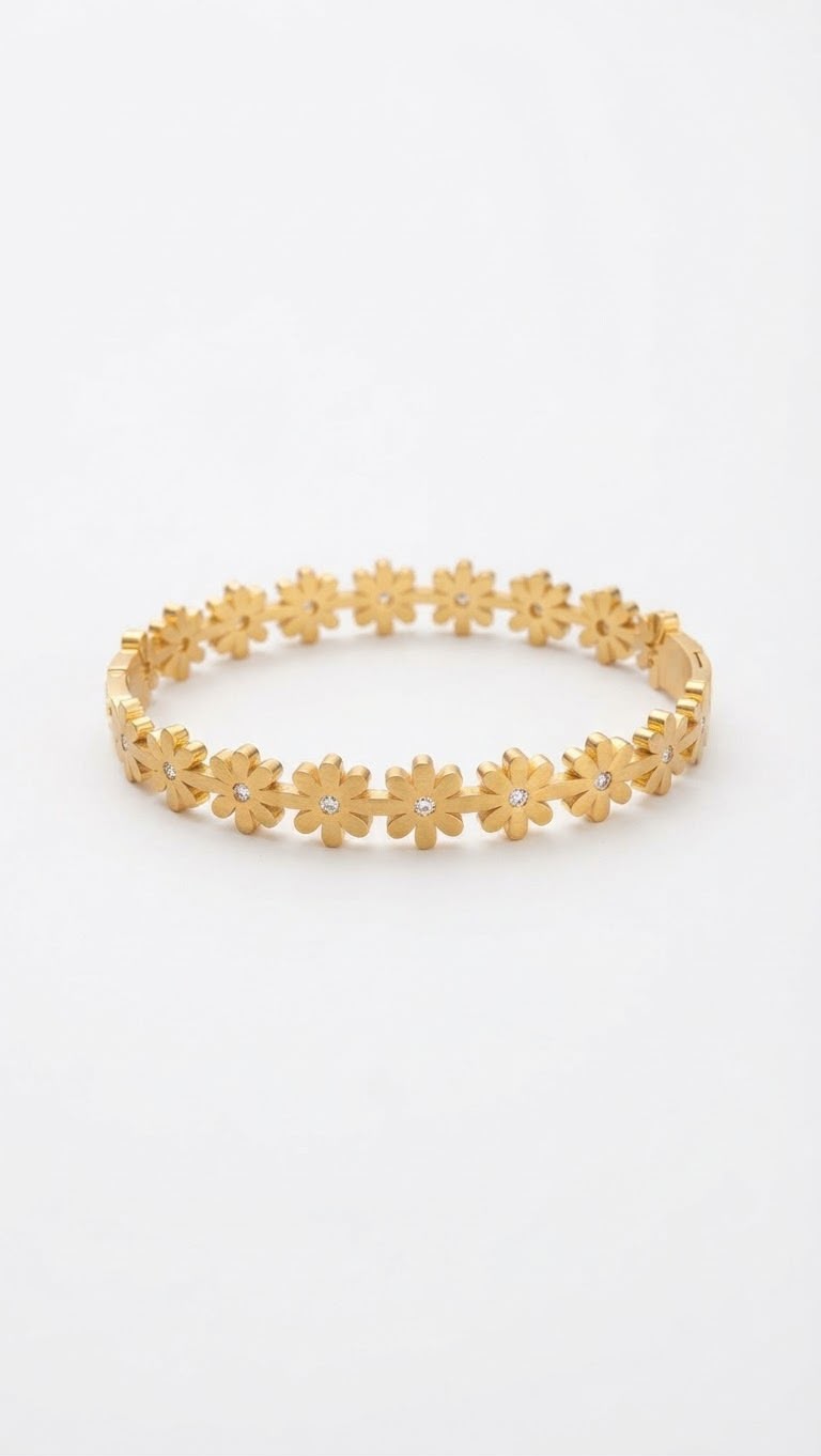 A gold flower bangle bracelet with small white gemstone centers, displayed on a clean white background.